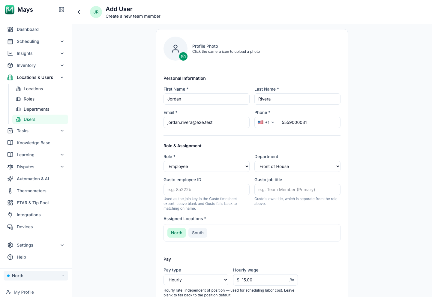 The Add User form in Mays filled in for a new hire, Jordan Rivera, with an email and phone number, the Employee role, the Front of House department, the North location and a $15.00 hourly wage