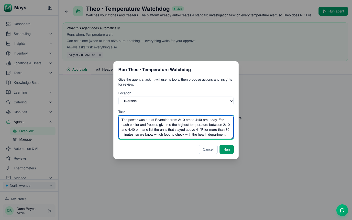 The Run Theo window in Mays over Theo, the Temperature Watchdog agent, for a test café's Riverside location, with a task typed in that asks, for each cooler and freezer, the highest temperature between 2:10 pm and 4:40 pm while the power was out, and which units stayed above 41°F for more than 30 minutes