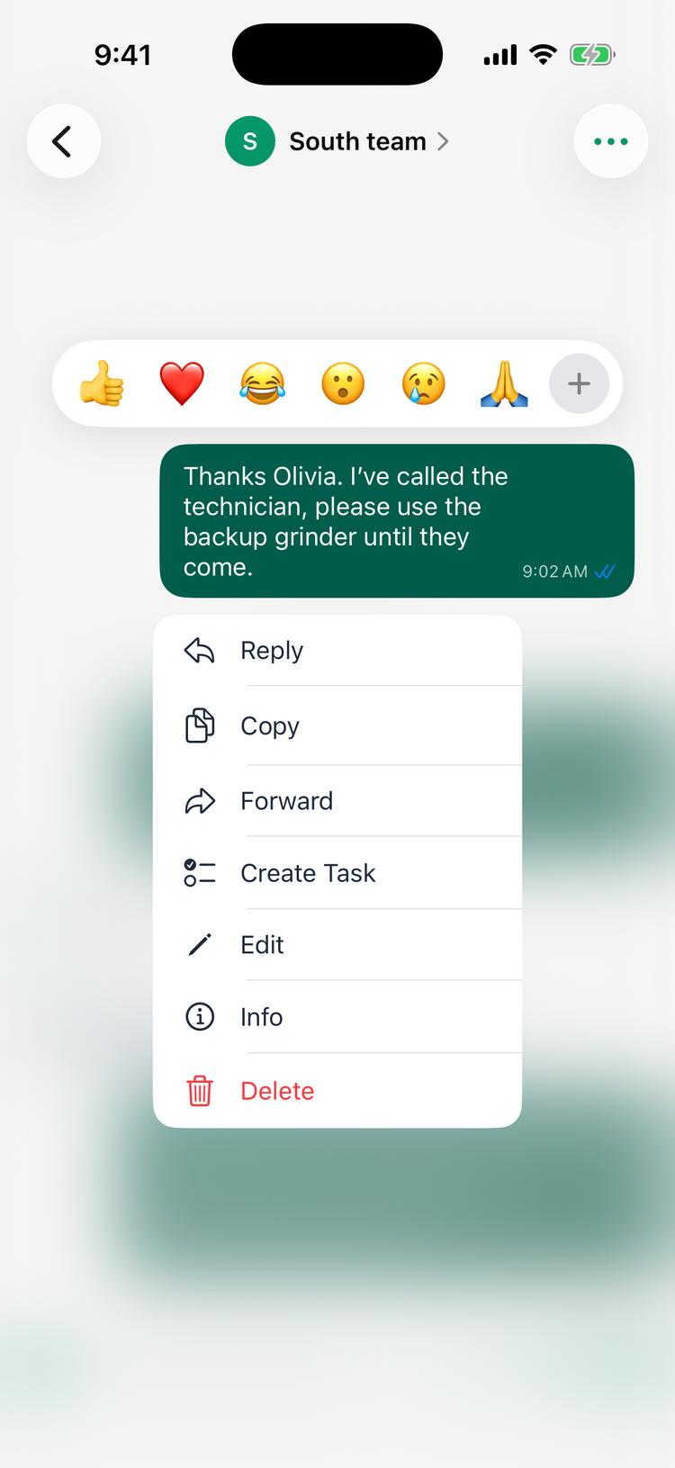 The message menu on iPhone for your own message: the reactions thumbs up, heart, laughing, surprised, crying, folded hands and +, and Reply, Copy, Forward, Create Task, Edit, Info and Delete