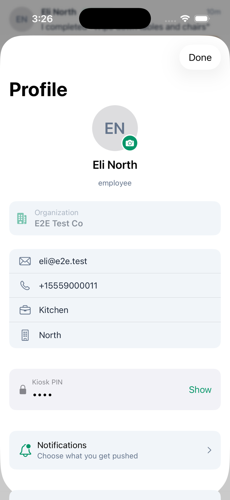 The Profile screen: the profile picture with a camera button, name and role, the Organization, email, phone, department and location, the Kiosk PIN with Show, and Notifications — Choose what you get pushed